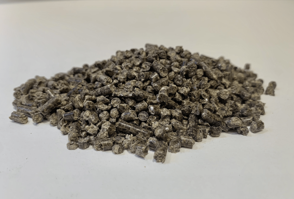 Close up image of a pile of all-natural lawn care soil amendment, BOOST-S3.